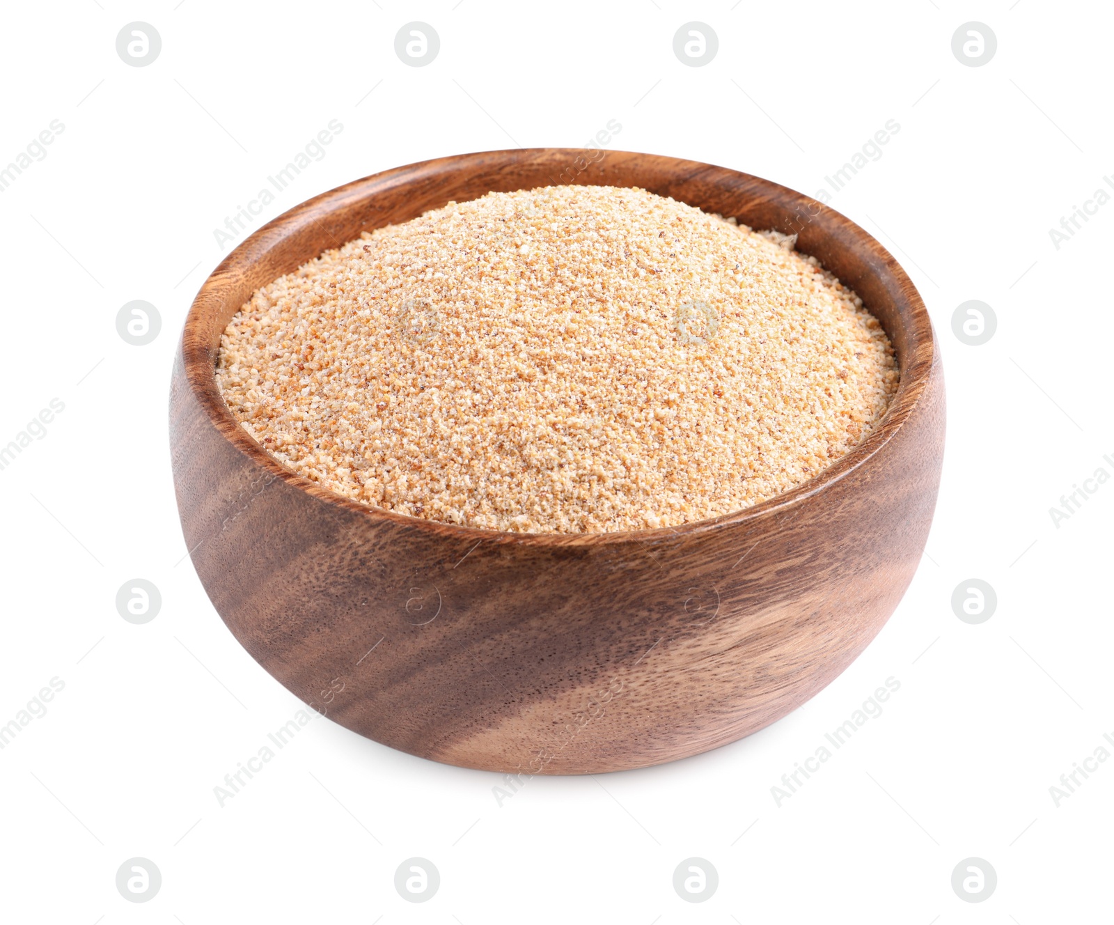 Photo of Fresh bread crumbs in wooden bowl isolated on white