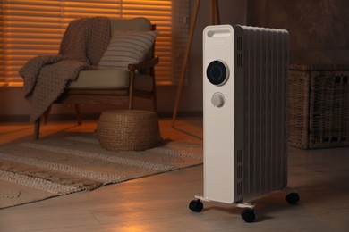 Photo of Modern portable electric heater indoors, space for text