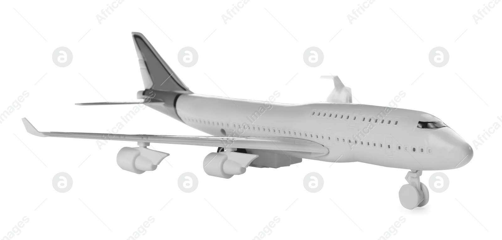 Photo of Toy airplane isolated on white. Travel concept