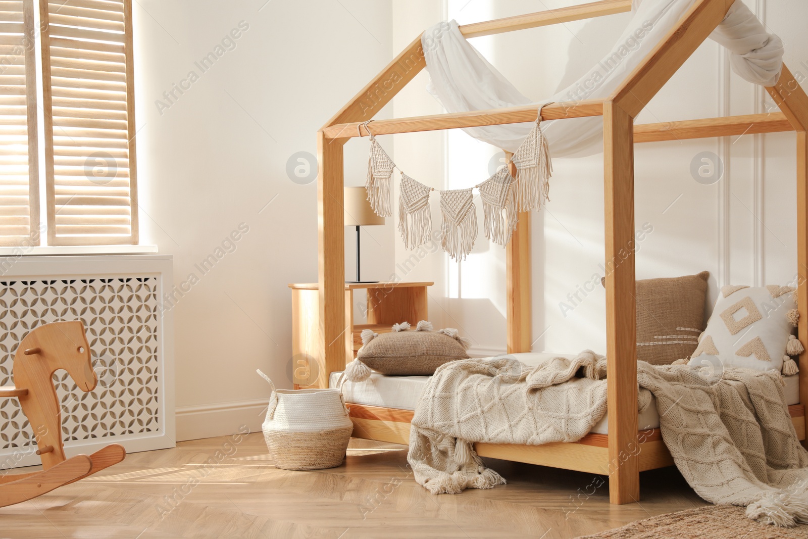 Photo of Stylish child room interior with house bed