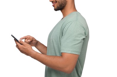 Man sending message via smartphone on white background, closeup