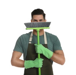 Photo of Man with green broom on white background