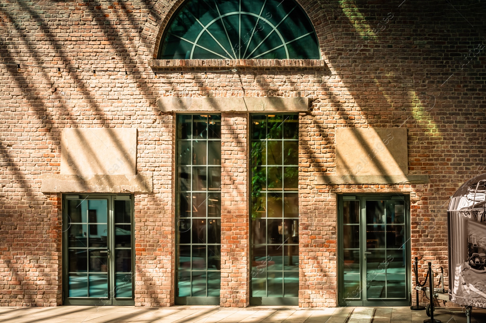 Photo of Beautiful building with large windows on sunny day