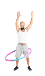 Photo of Overweight man with hula hoop on white background