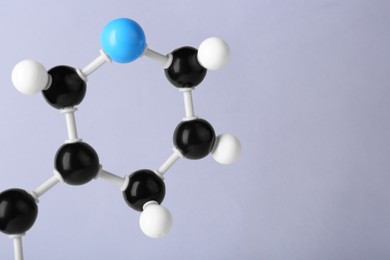 Photo of Molecule of vitamin B3 on light grey background, closeup and space for text. Chemical model