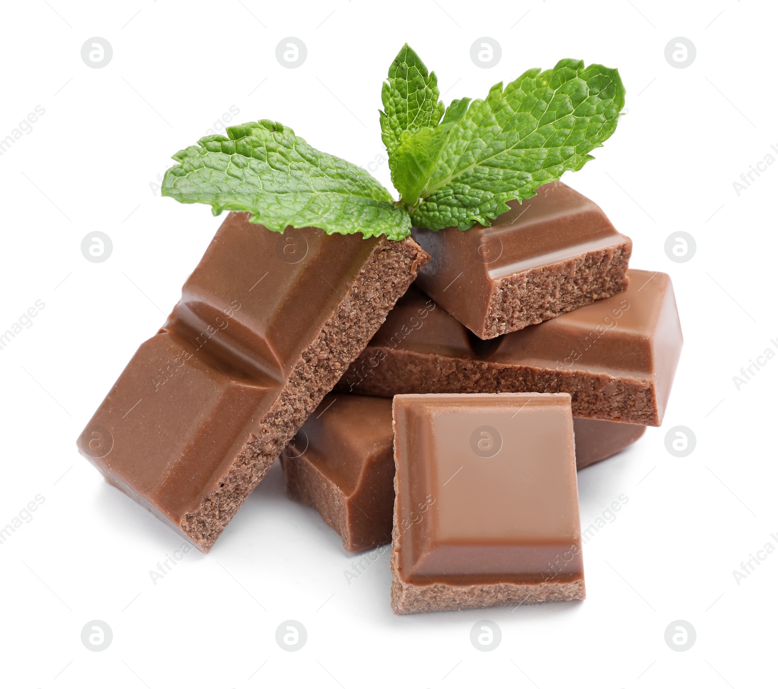 Photo of Pieces of milk chocolate with mint on white background