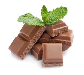 Pieces of milk chocolate with mint on white background