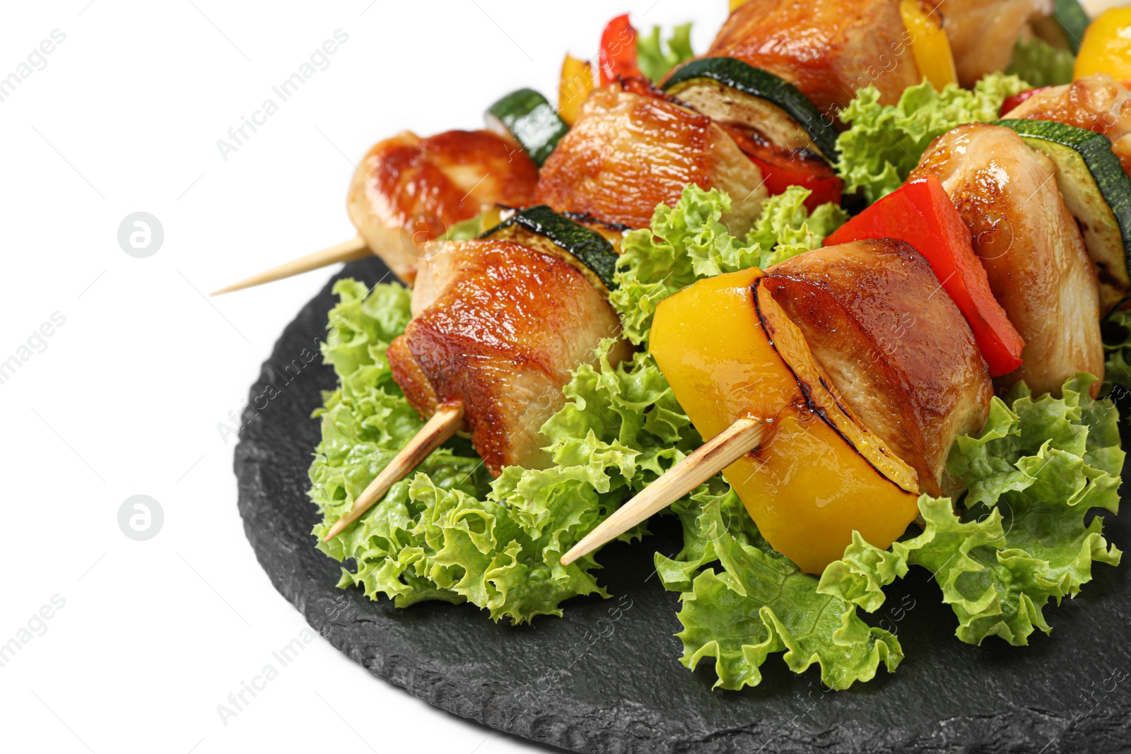 Photo of Delicious chicken shish kebabs with vegetables on white background, closeup