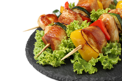 Photo of Delicious chicken shish kebabs with vegetables on white background, closeup