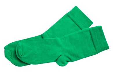 Photo of Pair of green socks on white background, top view