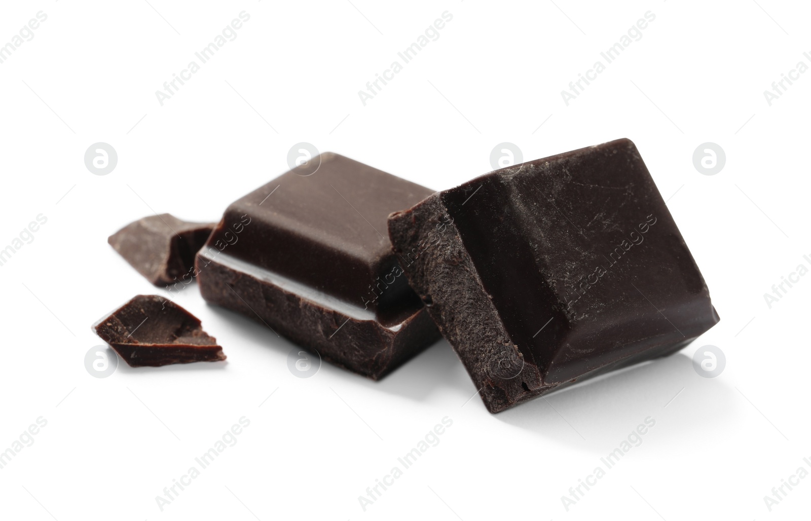 Photo of Pieces of delicious dark chocolate isolated on white