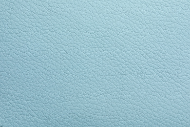 Texture of light blue leather as background, closeup