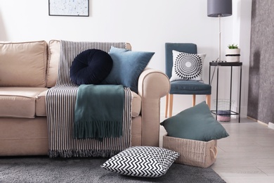 Living room interior with comfortable sofa and pillows