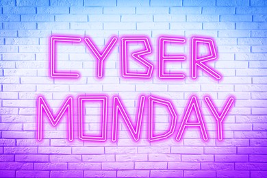Neon sign Cyber Monday on white brick wall 