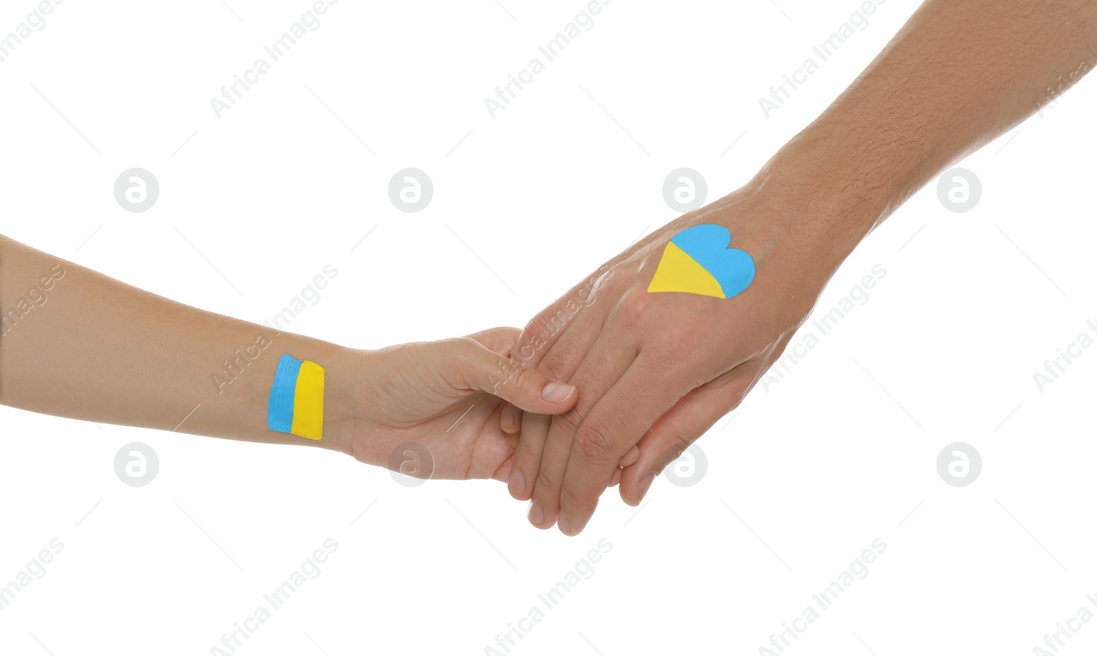 Photo of Man and woman with painted Ukrainian flags on their hands against white background, closeup