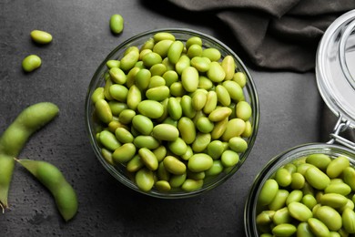 Organic edamame beans on grey table, flat lay