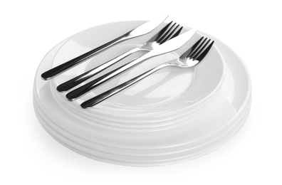 Photo of Stack of plates with forks and knife on white background