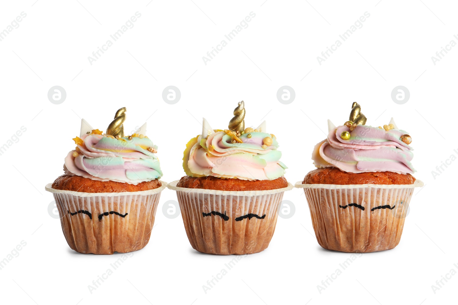 Photo of Cute sweet unicorn cupcakes isolated on white