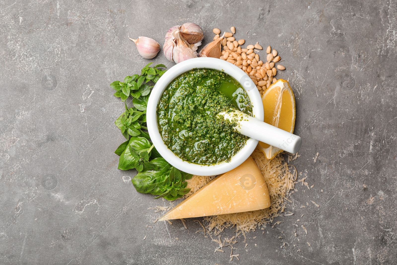 Photo of Flat lay composition with homemade basil pesto sauce and ingredients on table