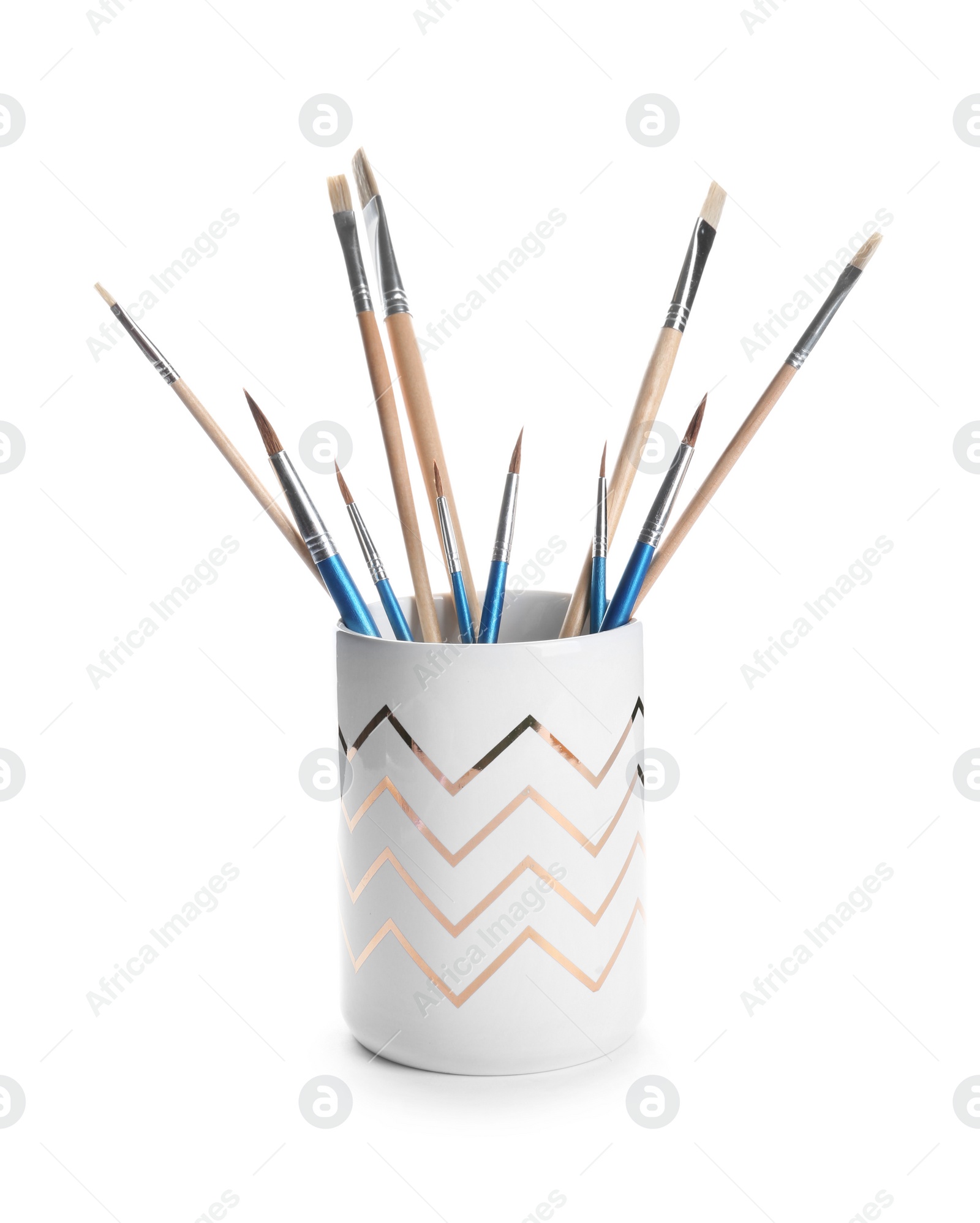 Photo of Holder with different paint brushes on white background