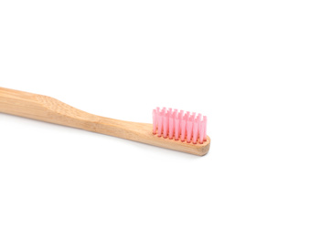 Photo of Bamboo toothbrush with pink bristle isolated on white