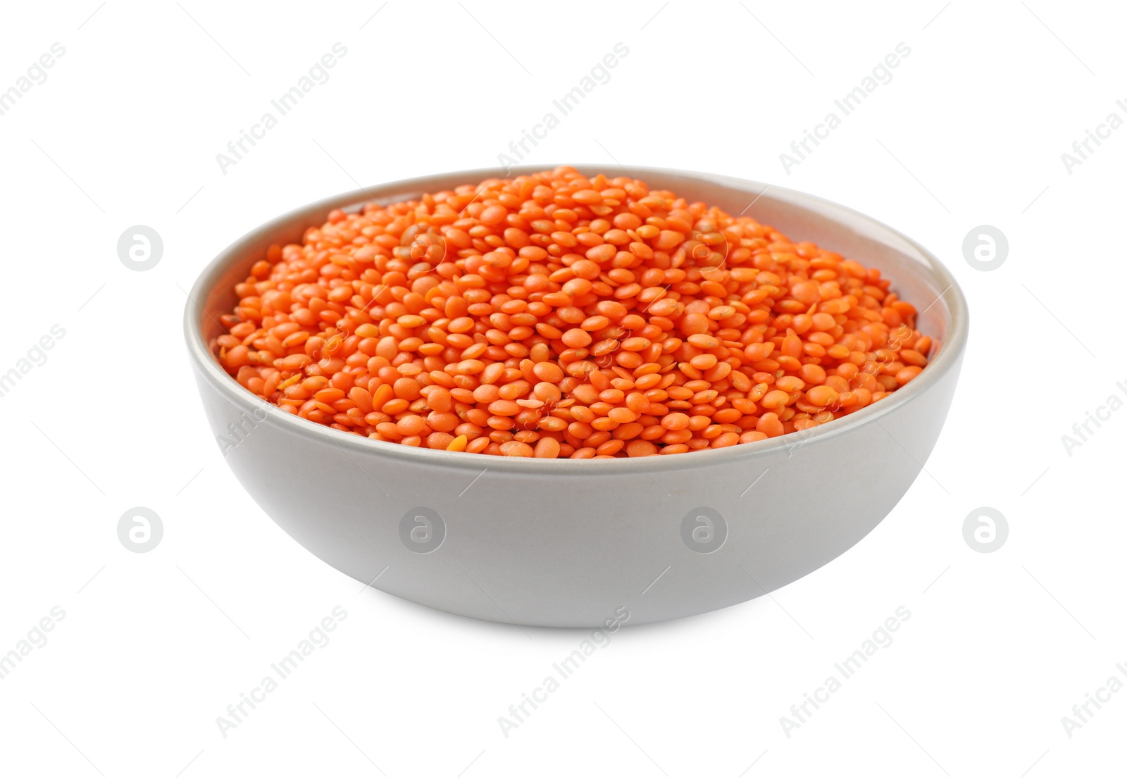 Photo of Raw red lentils in bowl isolated on white