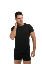 Photo of Handsome man in black underwear and t-shirt on white background