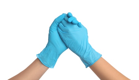 Photo of Doctor in medical gloves shaking hands on white background, closeup