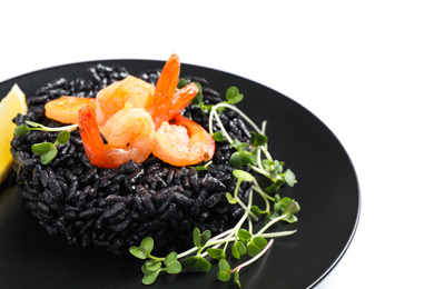 Delicious black risotto with shrimps isolated on white, closeup