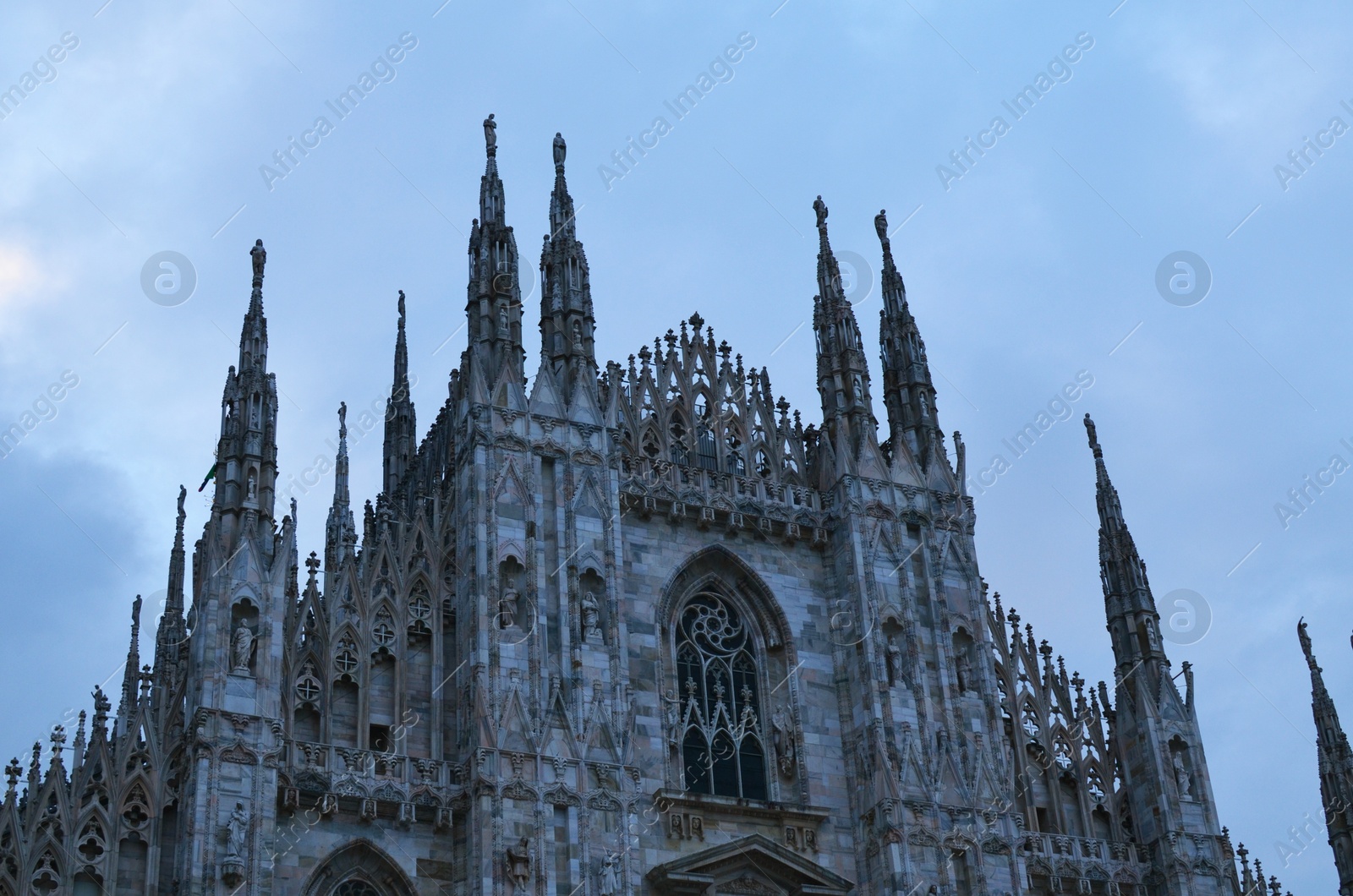 Photo of Beautiful old gothic cathedral under blue sky