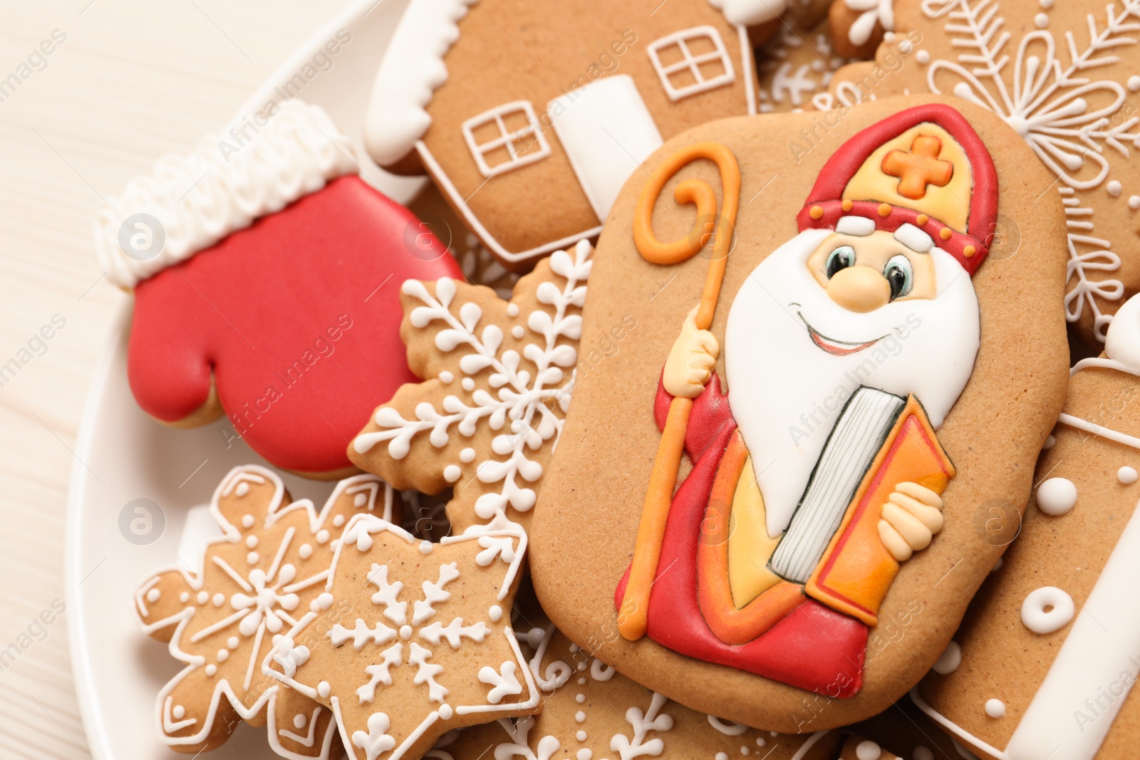 Photo of Tasty gingerbread cookies on plate, above view. St. Nicholas Day celebration