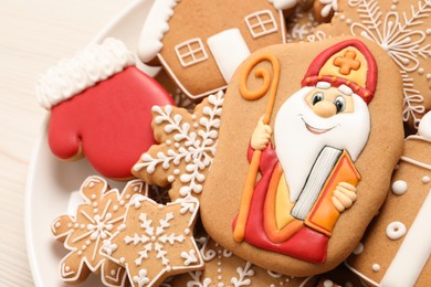 Tasty gingerbread cookies on plate, above view. St. Nicholas Day celebration