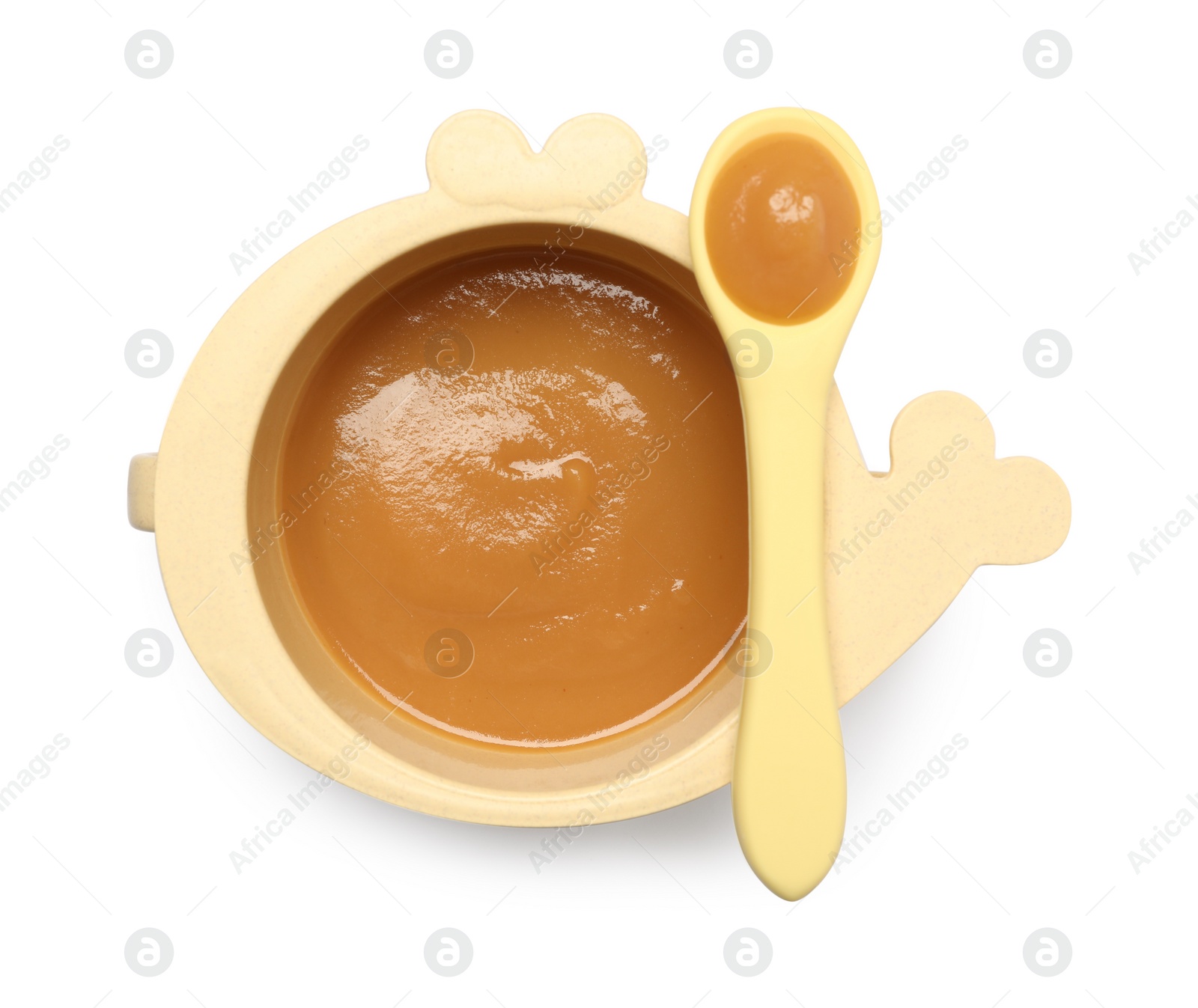 Photo of Delicious baby food in bowl and spoon isolated on white, top view