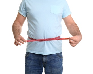 Photo of Overweight man with measuring tape on white background