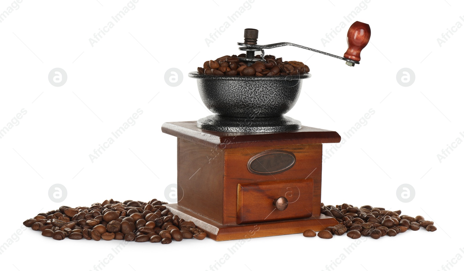 Photo of Vintage manual coffee grinder with beans on white background