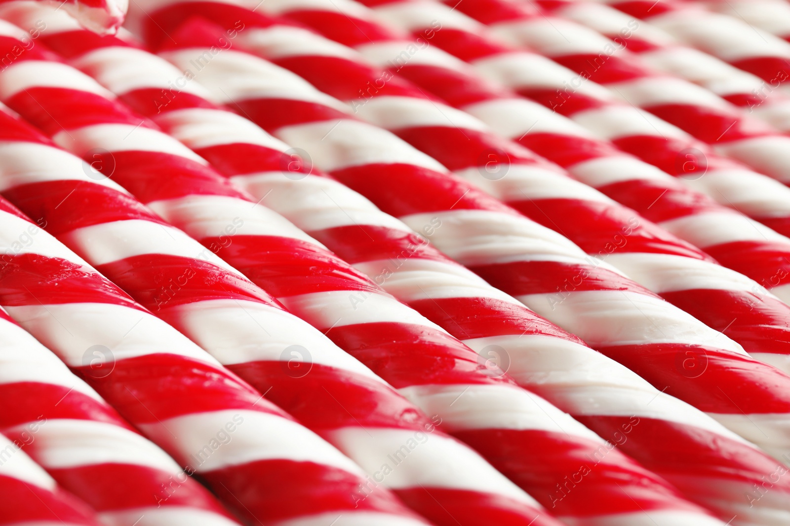 Photo of Many candy canes as background. Festive treat