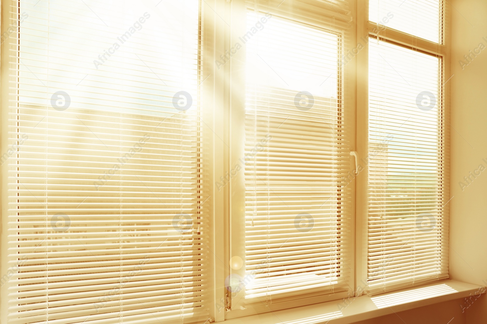 Image of Stylish window with horizontal blinds in room