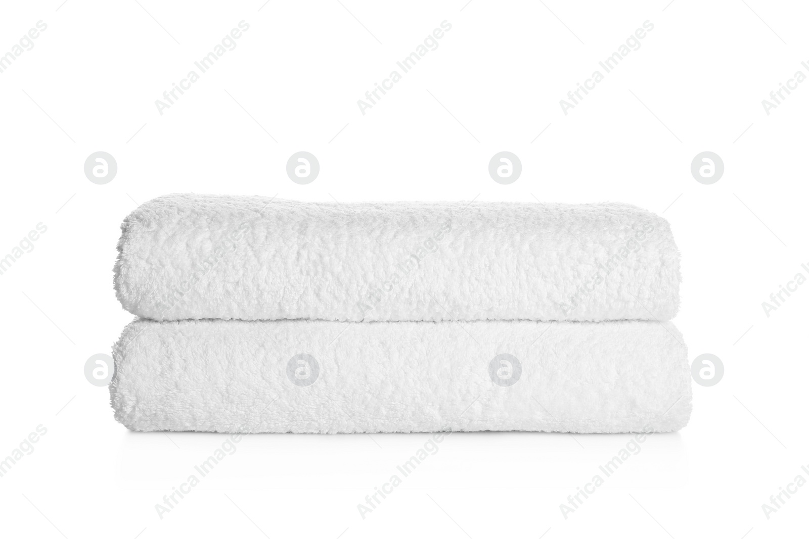 Photo of Stack of clean soft towels on white background