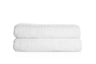 Stack of clean soft towels on white background