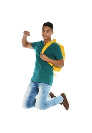 Photo of African-American teenager boy in casual clothes on white background
