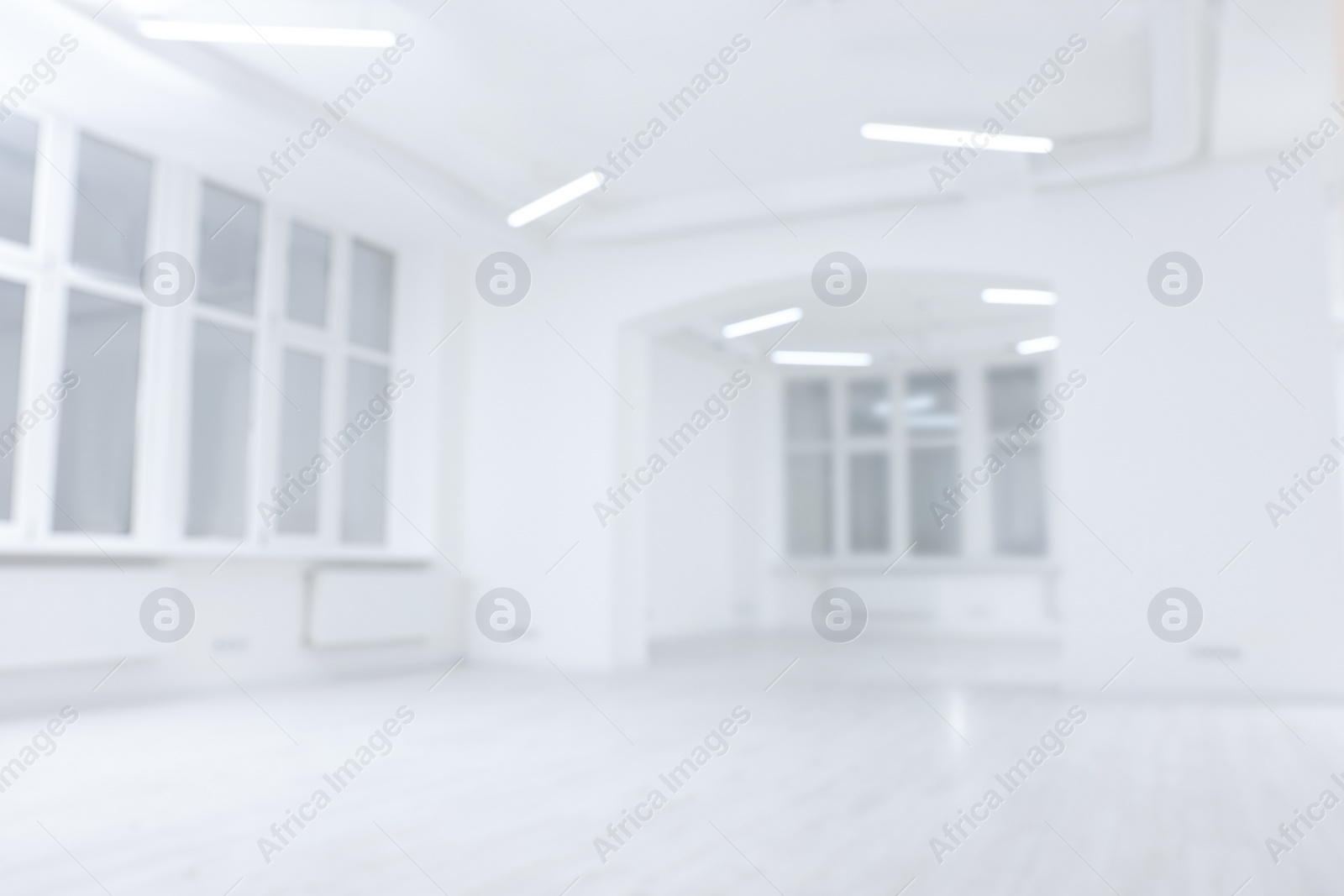 Photo of Blurred view of spacious room with windows during repair