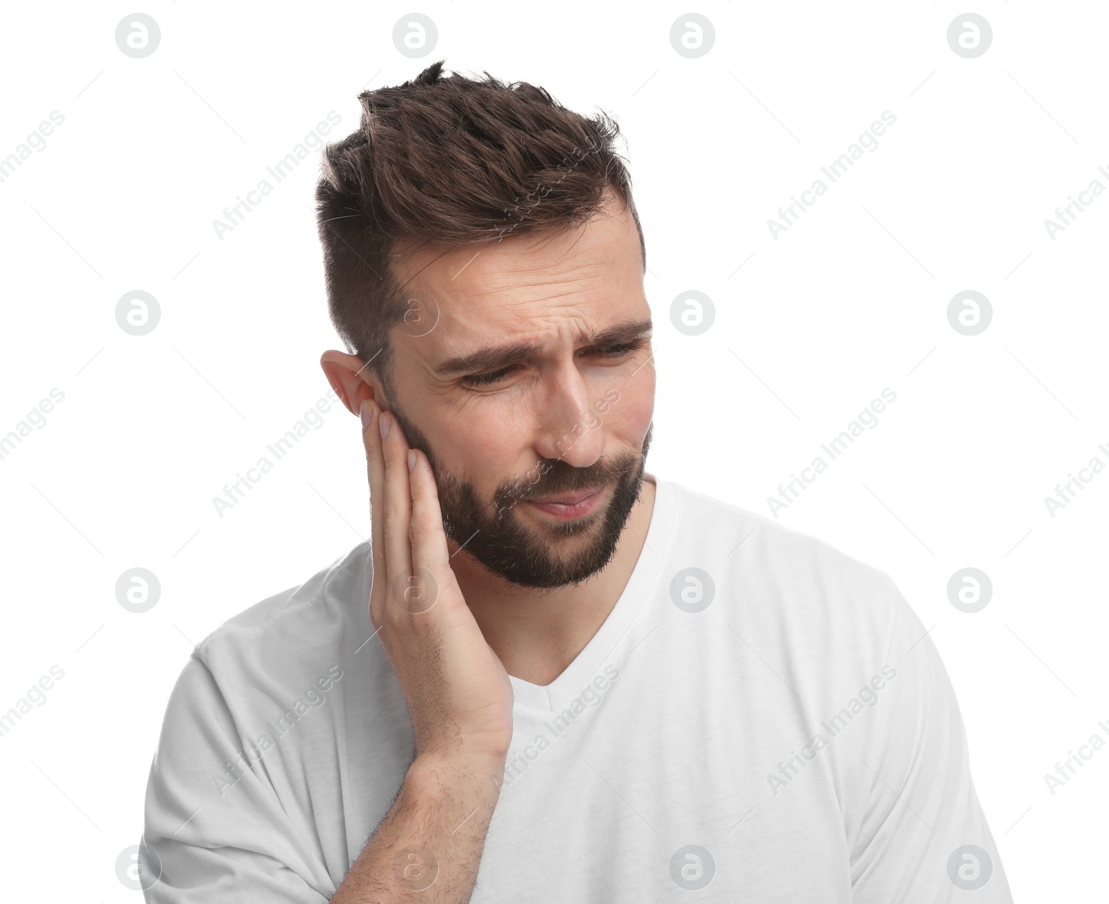 Photo of Man suffering from ear pain on white background