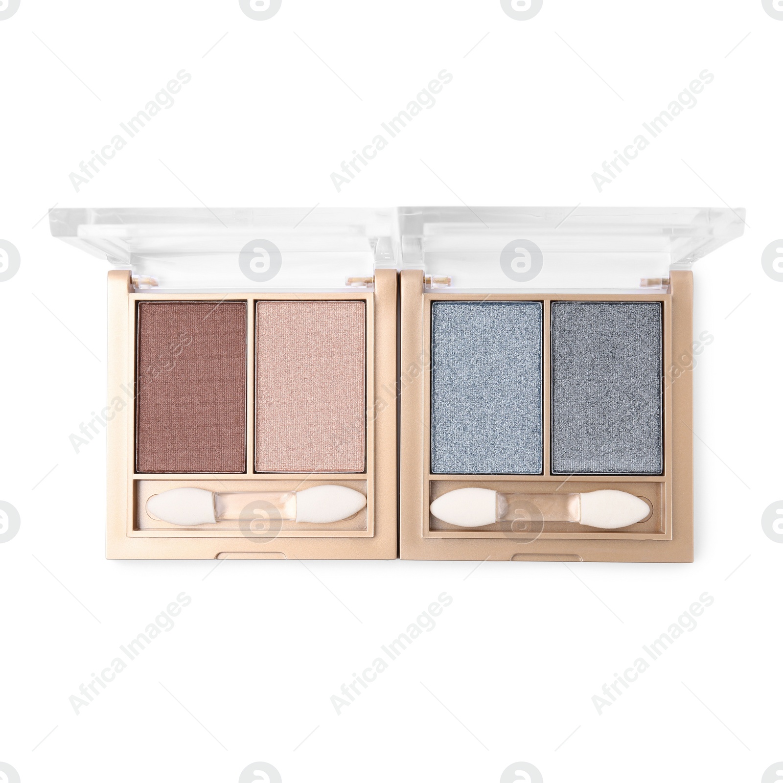 Photo of Beautiful eye shadow palettes with brushes isolated on white, top view