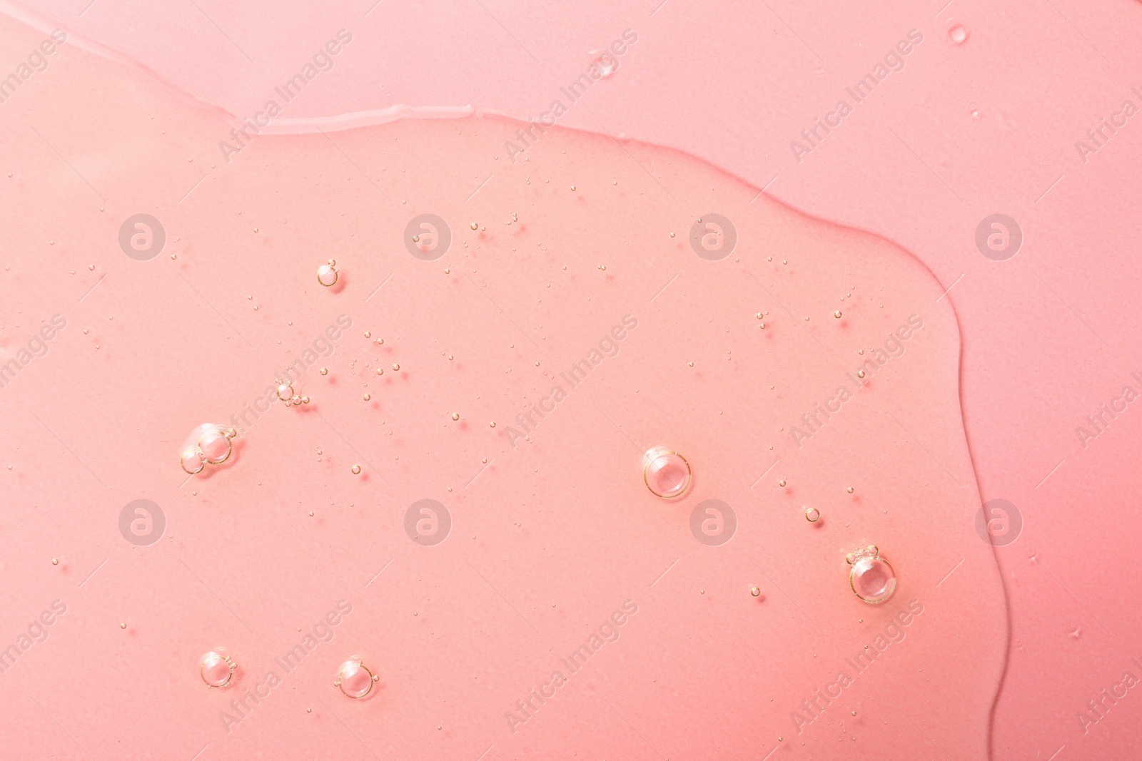 Photo of Sample of hydrophilic oil on pink background, top view