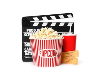 Photo of Popcorn bucket, clapper, drink and tickets isolated on white. Cinema snack