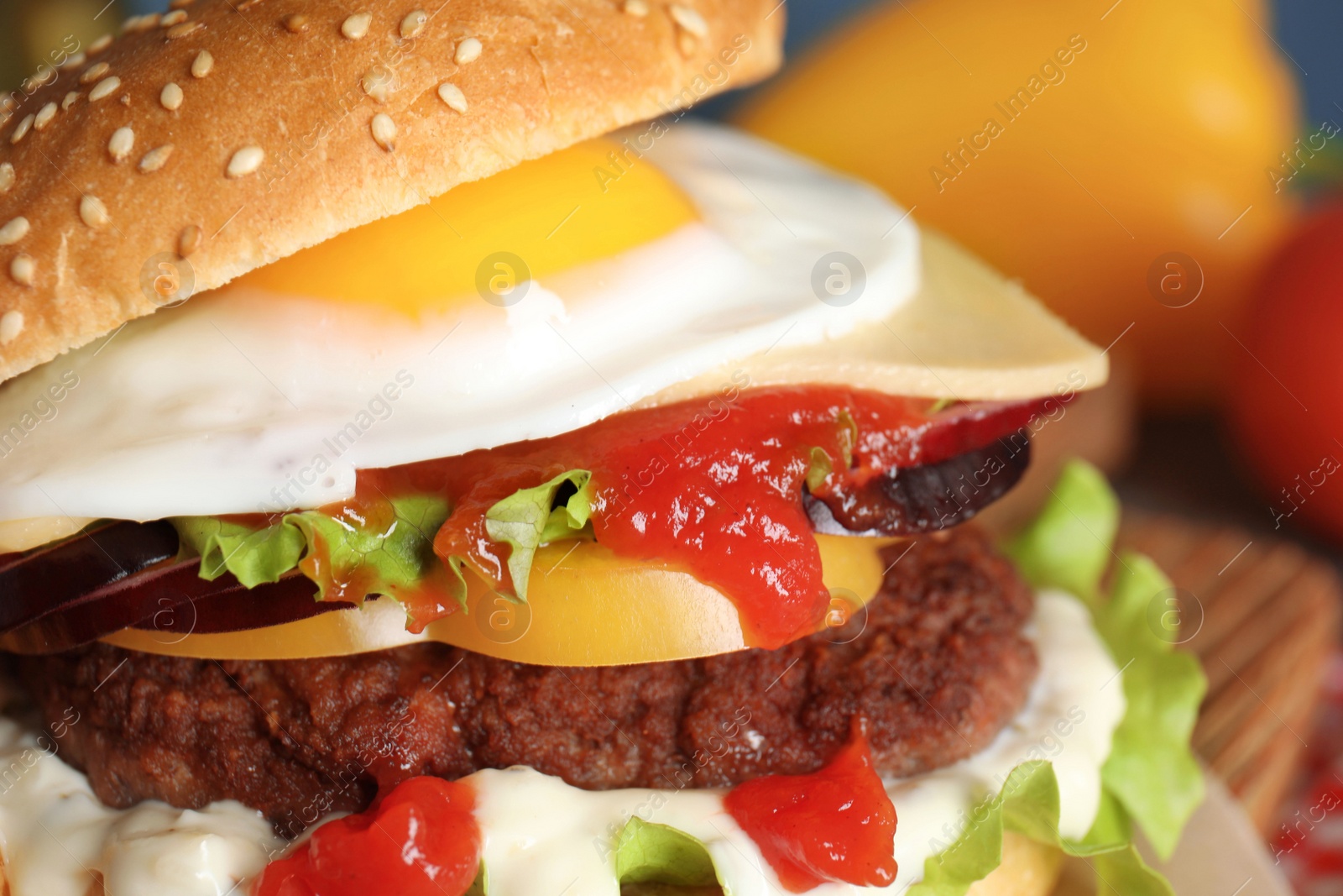 Photo of Closeup view of tasty burger with fried egg