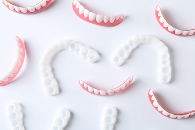 Photo of Flat lay composition with teeth covers on white background
