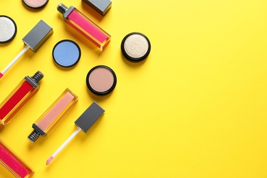Photo of Composition with lipsticks on color background, flat lay. Space for text