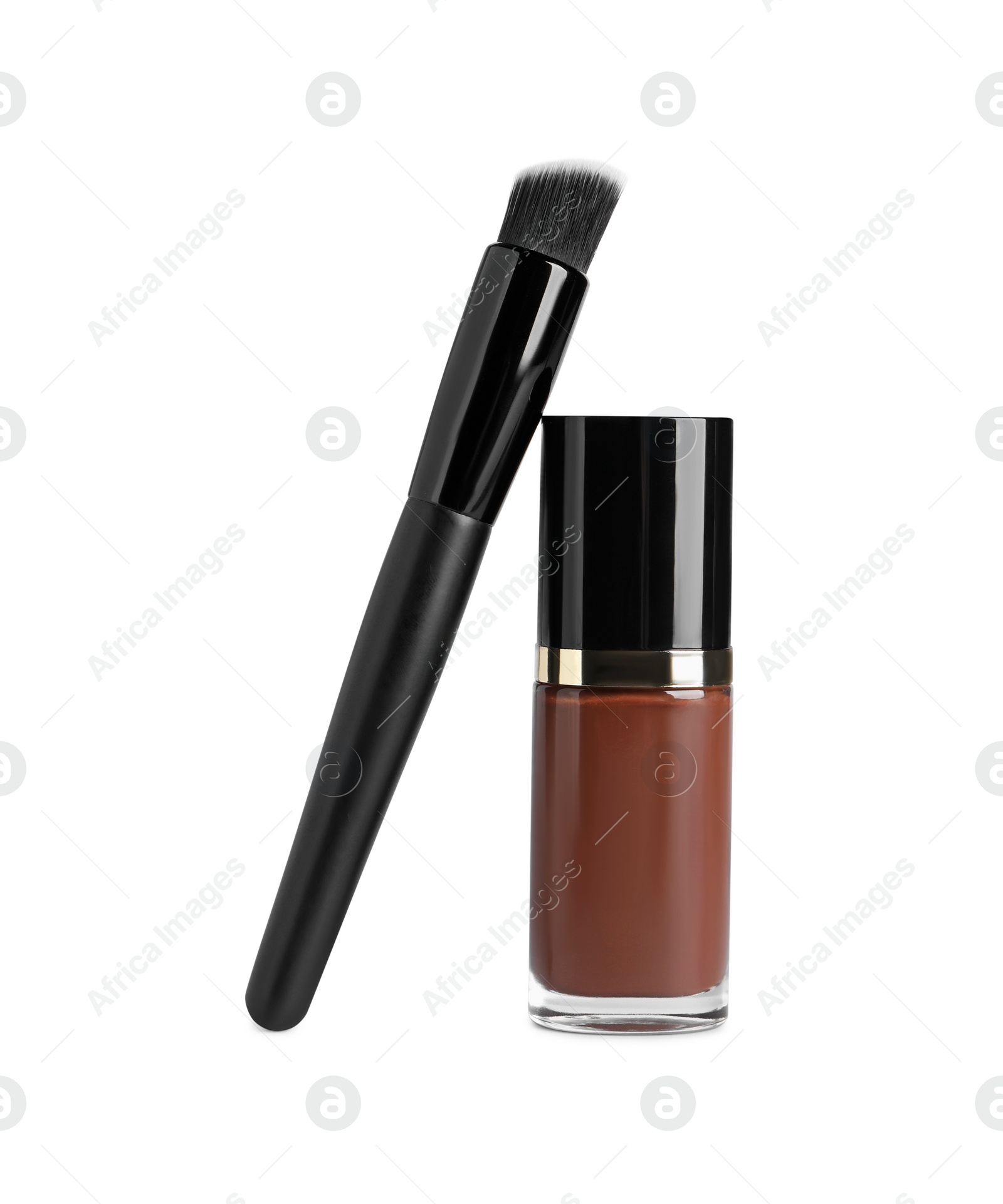 Photo of Bottle of skin foundation and brush on white background. Makeup product