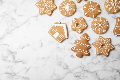 Photo of Tasty homemade Christmas cookies on marble background, top view